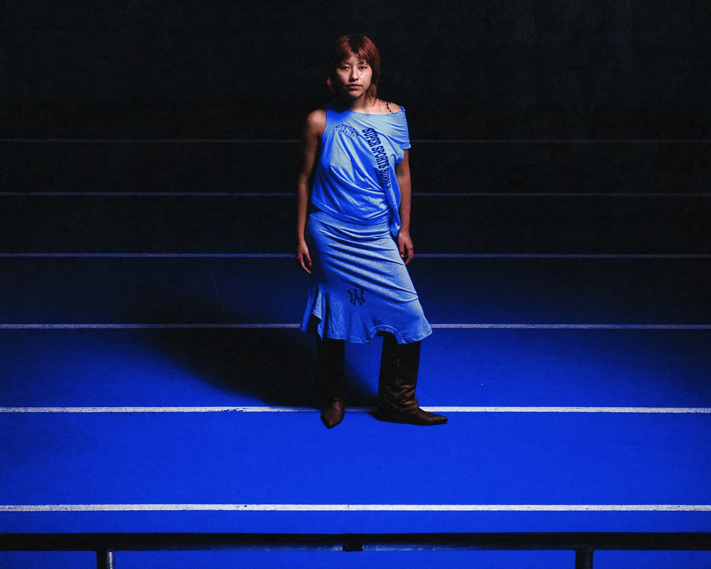 Gina Corrieri SS24 editorial, blue track, blue dress. Photo by George William Vicary.
