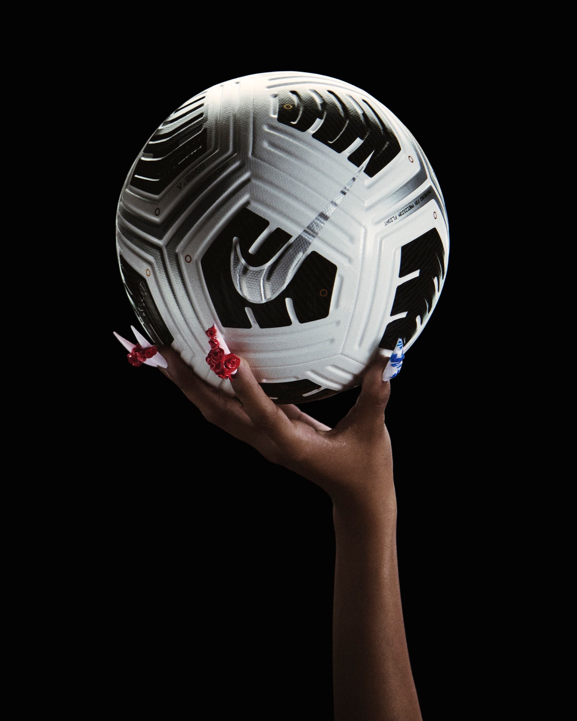 Football-themed nail art detail from the SU25 Fear Nothing campaign.